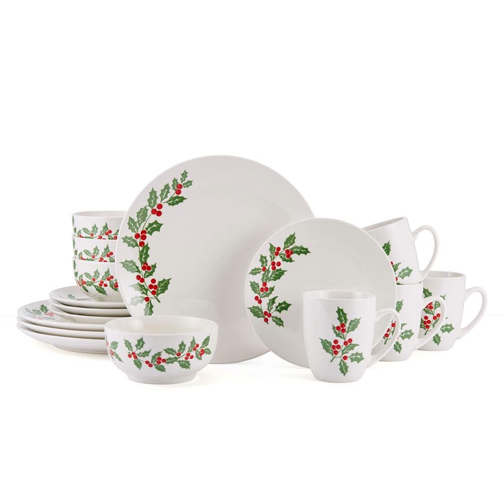 Holly Cheer 16 piece dinnerware set for four shown with plates bowls and mugs decorated with holly borders on white.