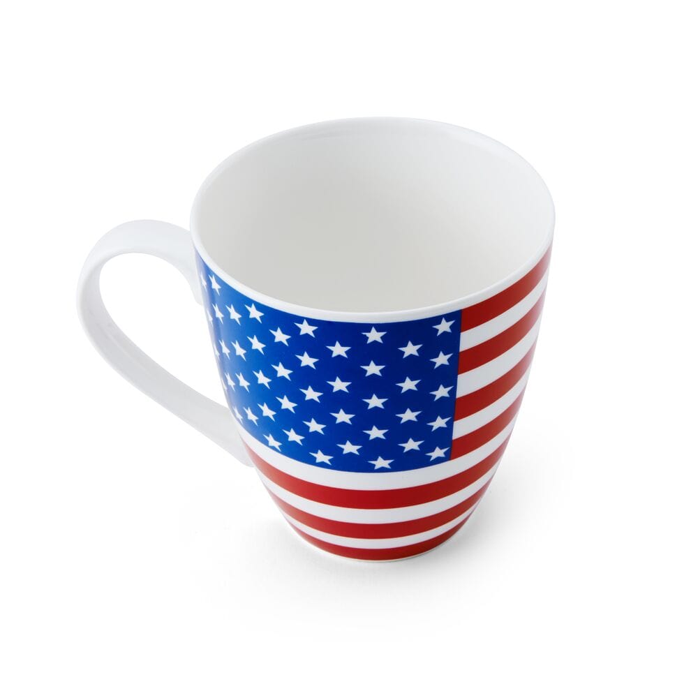White ceramic mug wrapped in an American flag design featuring blue field with stars and red white stripes