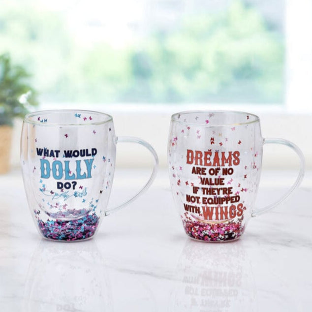 Two mugs with motivational quotes on a light surface with a blurred natural background