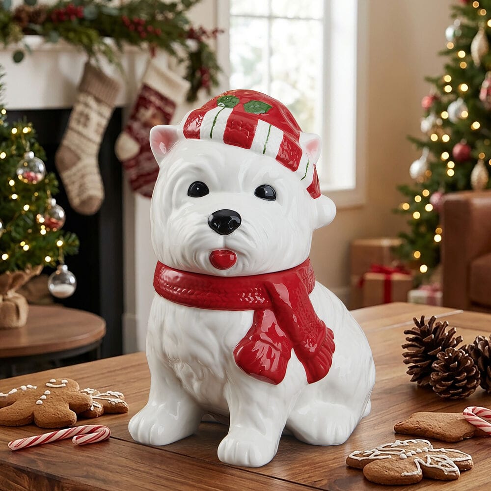 Winterberry Westie Dog Holiday Cookie Jar on a festive table with a Christmas tree in the background